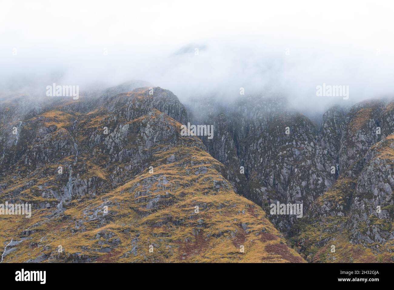 Glen Etive mountain tops shrouded in mist, Scotland, UK Stock Photo