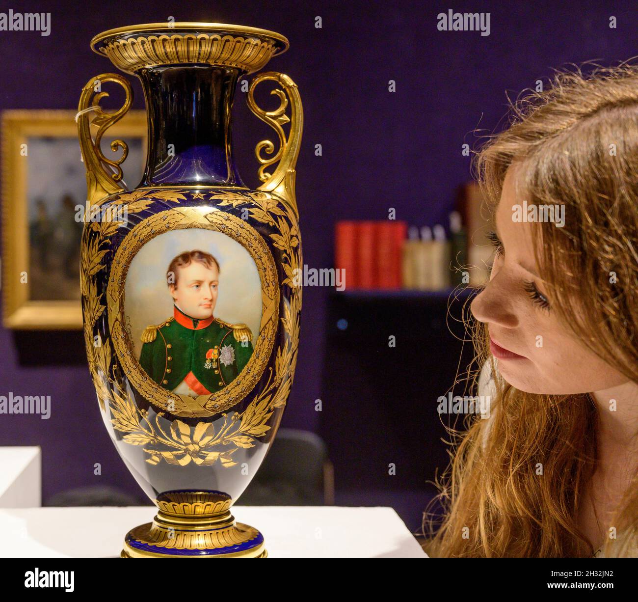 Bonhams, London, UK. 25 October 2021. Personal items and artefacts from the Napoleonic period include paintings, manuscripts, Bicorne Hat, china and medals. Image: A Sèvres blue-ground vase 'carafe Étrusque' with the portrait of Napoleon I, dated 1852. £ 30,000 - 40,000. Credit: Malcolm Park/Alamy Live News Stock Photo