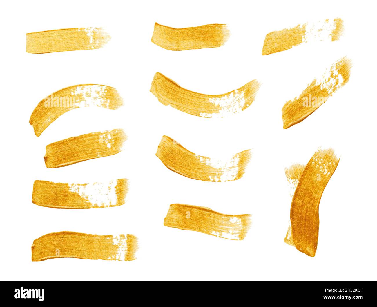 Set of golden paint strokes isolated on white background Stock Photo