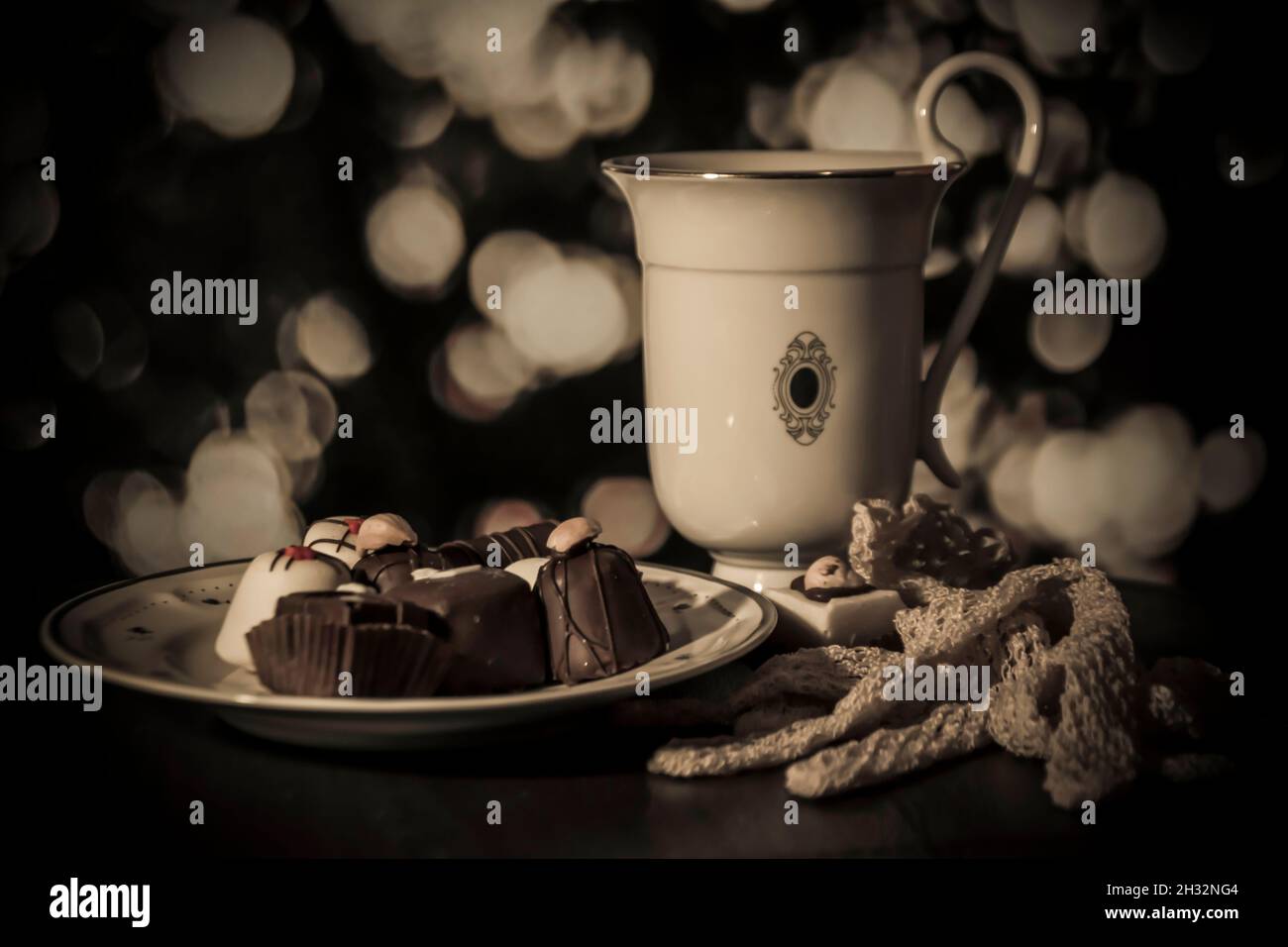 Fancy tea and cookies setup with bokeh background Stock Photo