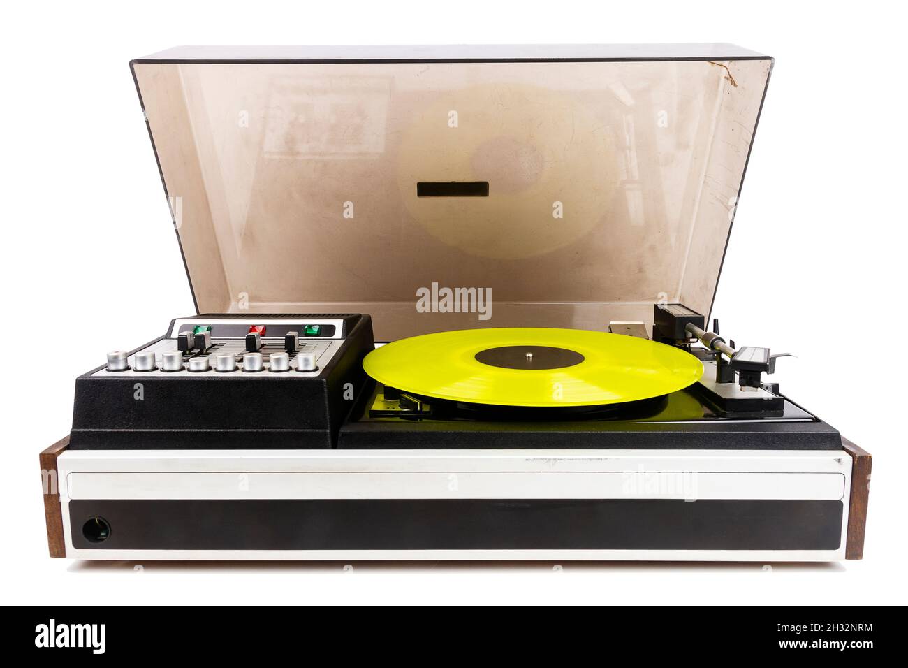 Vintage turntable record player with yellow vinyl isolated on white ...