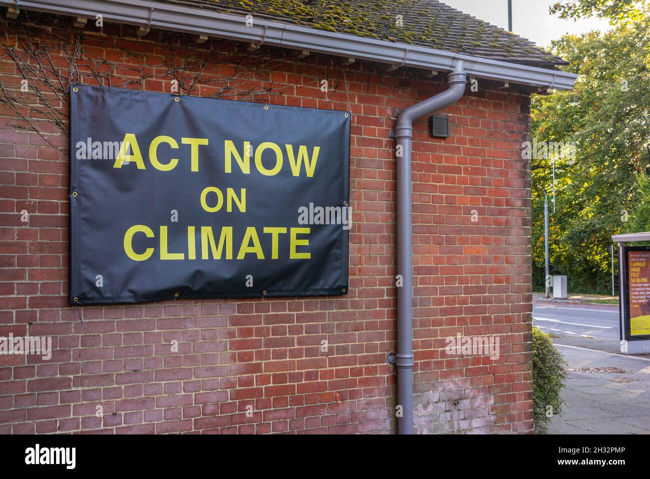 Act on Climate banner on a building facade in Southampton, Hampshire, England, UK Stock Photo