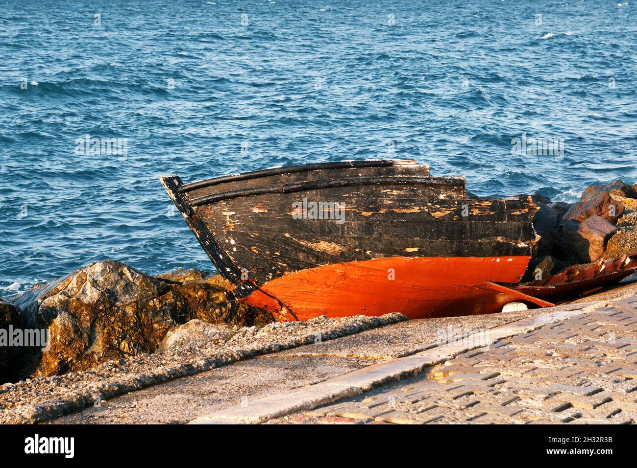 Old broken wooden fishing boat on the sea shore Stock Photo - Alamy