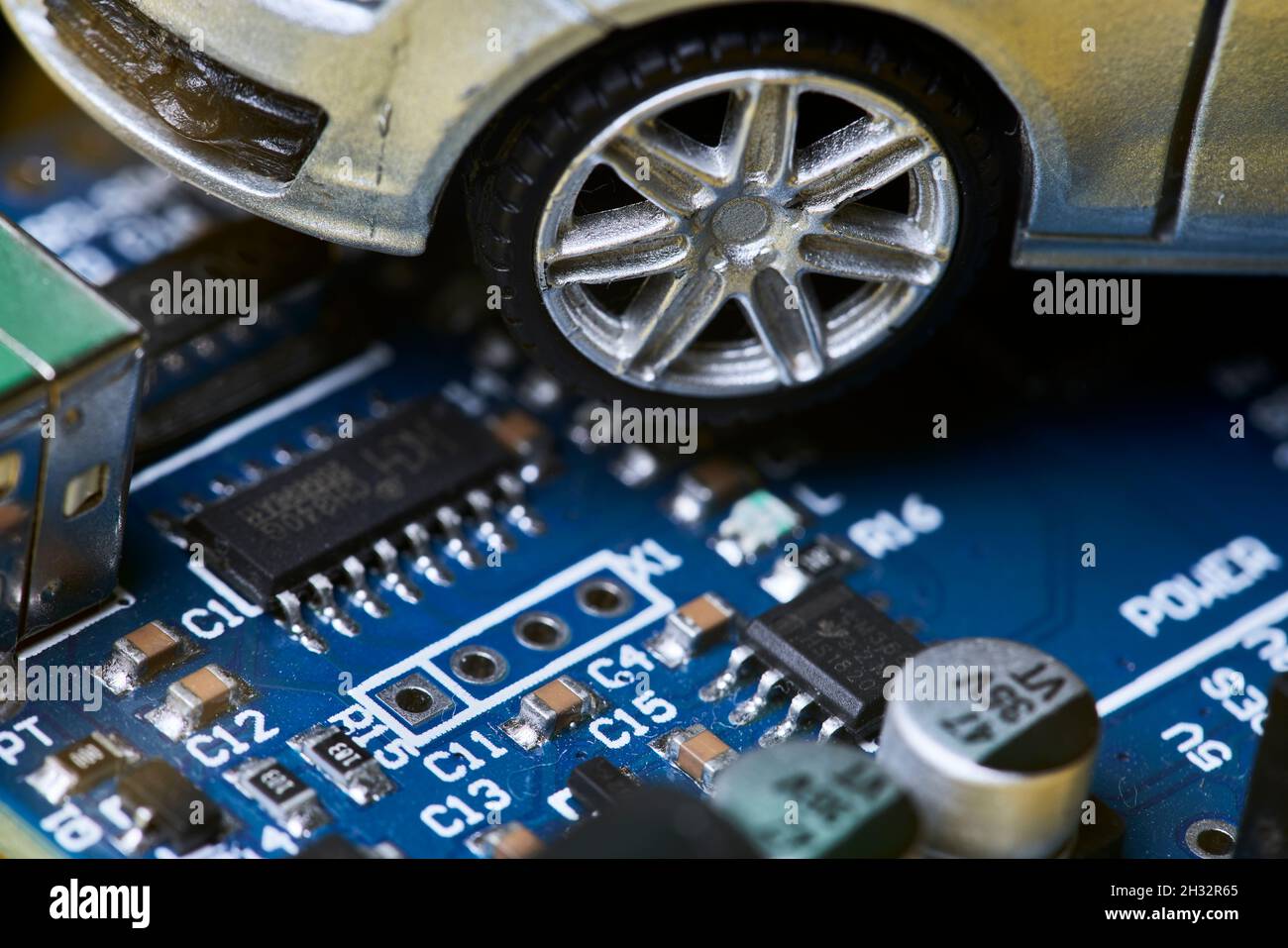 CPU chip and semiconductors with car toy. Global car chip shortage. Microchip shortage creates