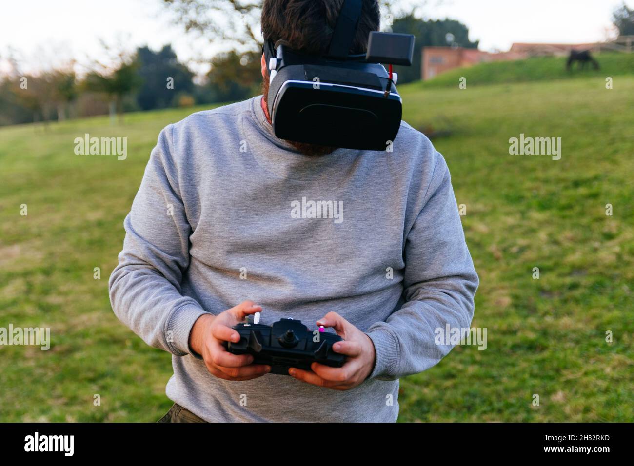 Man with virtual reality goggles and drone control controller Stock Photo
