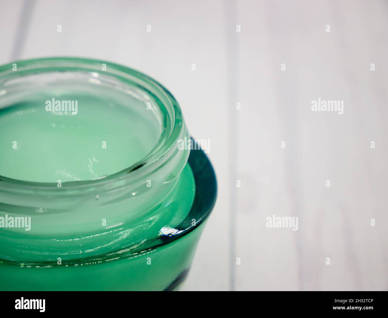 spa related object on white background, Green Body cream. Body and skin care flat lay with copy space. Beauty care concept Stock Photo