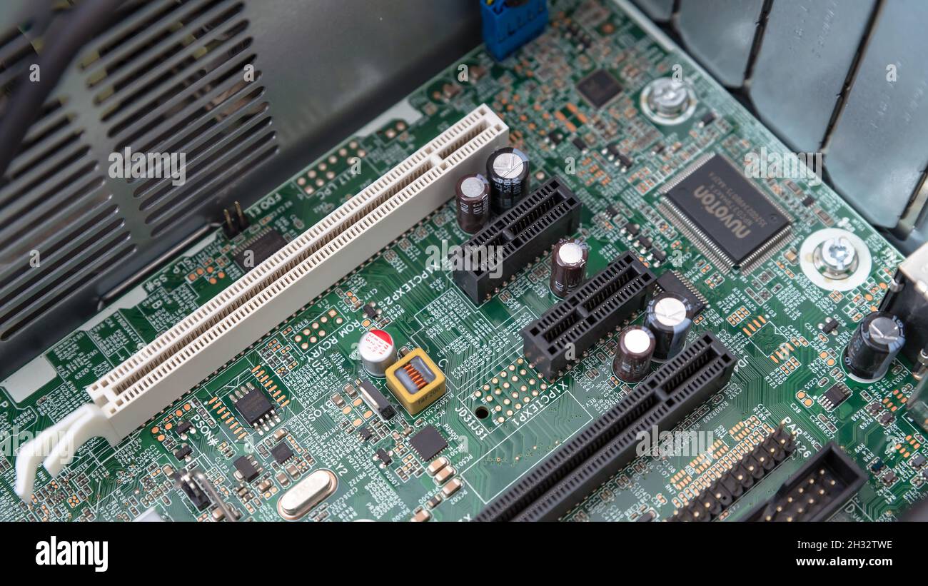 Woodville, Australia - October 15, 2021: Close-up top view of motherboard PCI and PCI Express slots installed in a small factor business desktop Stock Photo