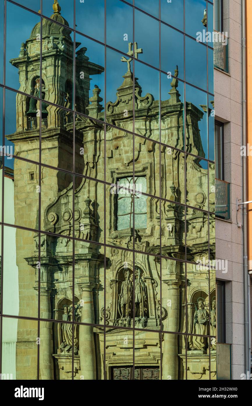 Reflection in glass facade of the Church of San Jorge in the city of A Coruna, in Galicia, Spain  Stock Photo