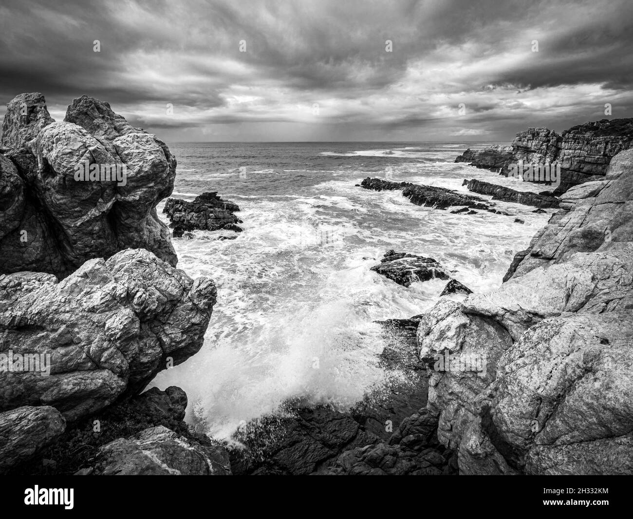 View on a cloudy day toward Sievers Point from the Cliff Path. Hermanus. Whale Coast. Overberg. Western Cape. South Africa Stock Photo
