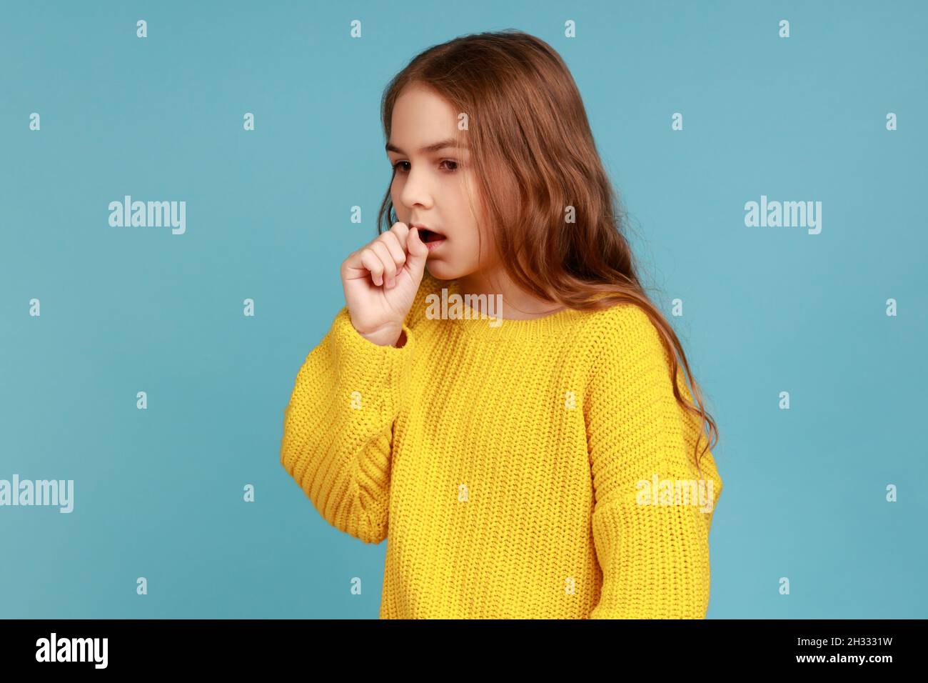 Portrait of unhealthy sick little girl having flu symptoms, coughing