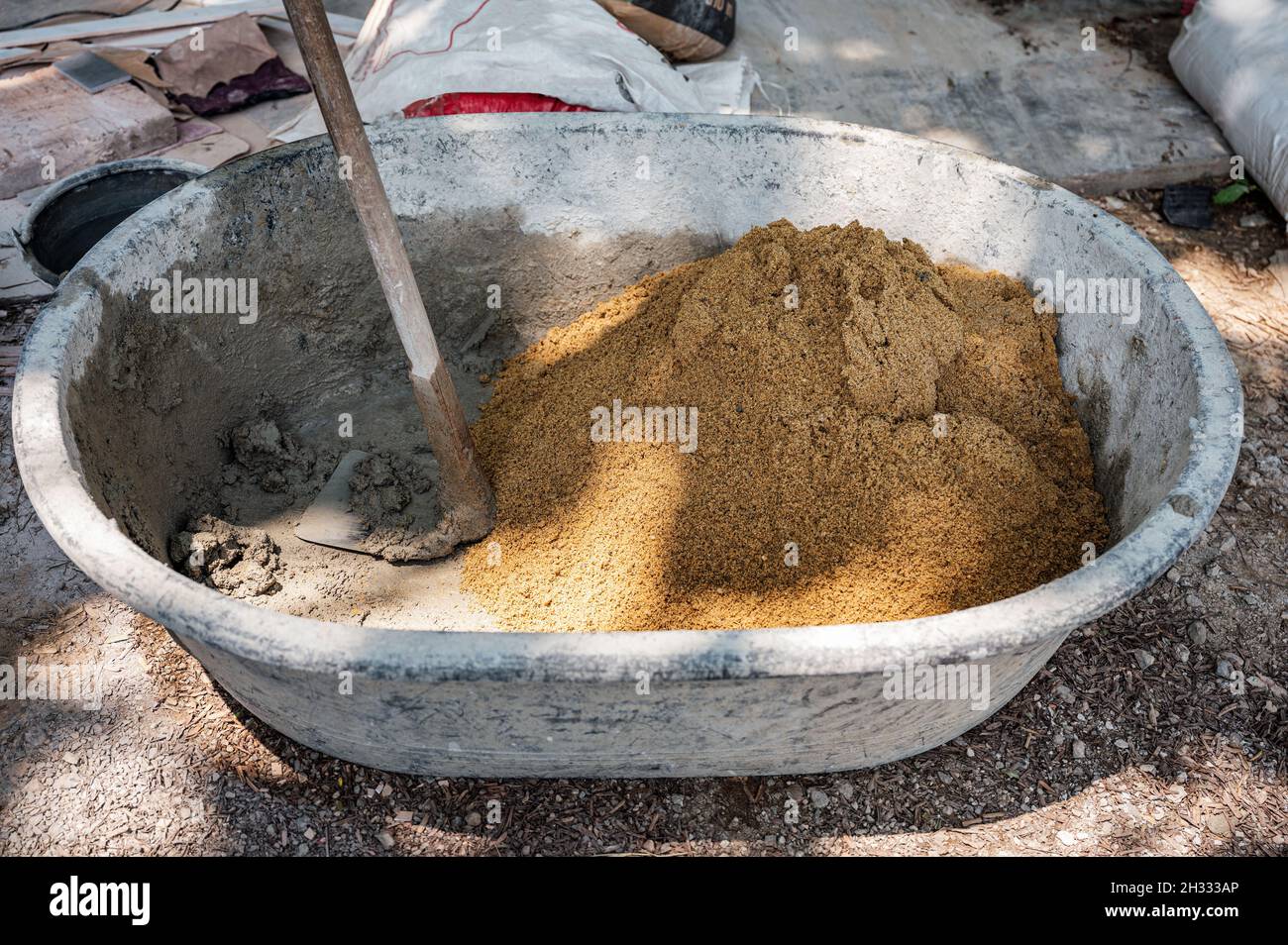 Mixing water with sand hires stock photography and images Alamy
