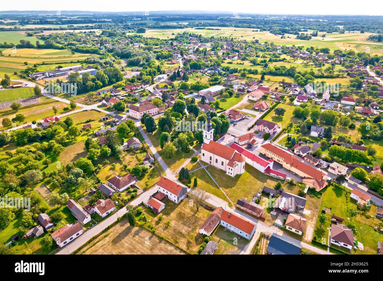 Village of Legrad church and green landscape aerial view, Podravina region of Croatia Stock Photo