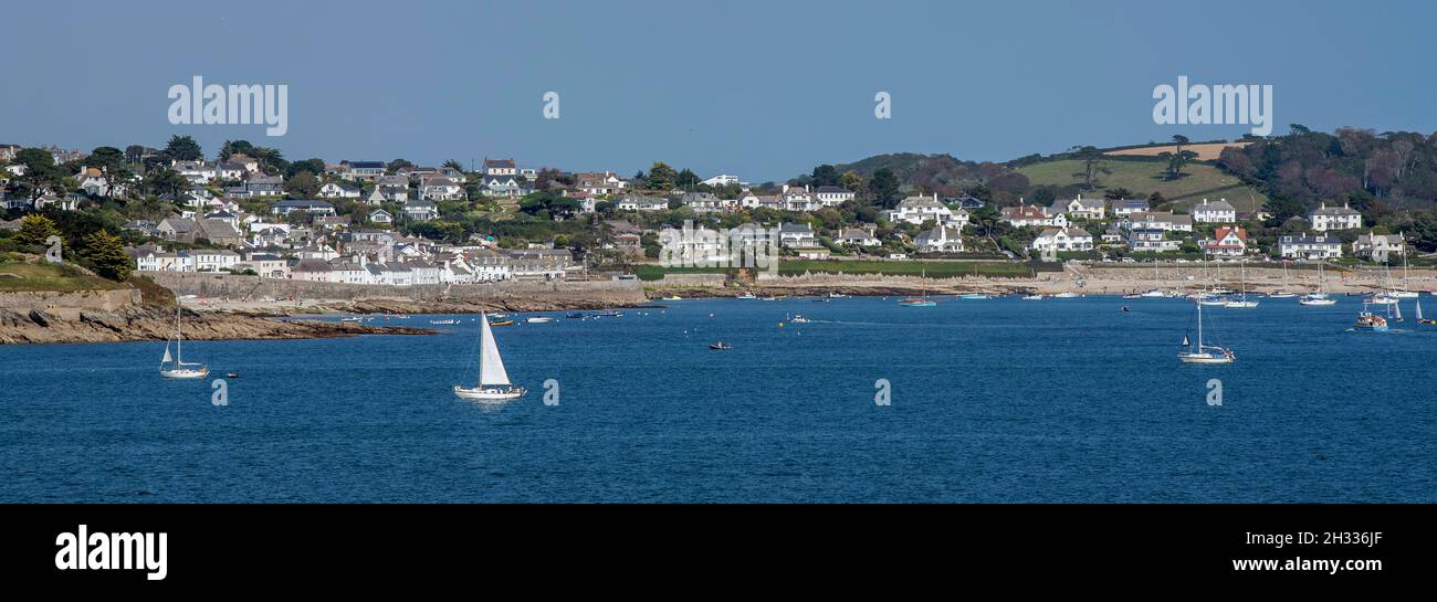 St. Mawes, Cornwall, England, UK. 2021.  A view of St Mawes a popular Cornish holiday resort across the Carrick Roads, Falmouth, Cornwall, UK Stock Photo