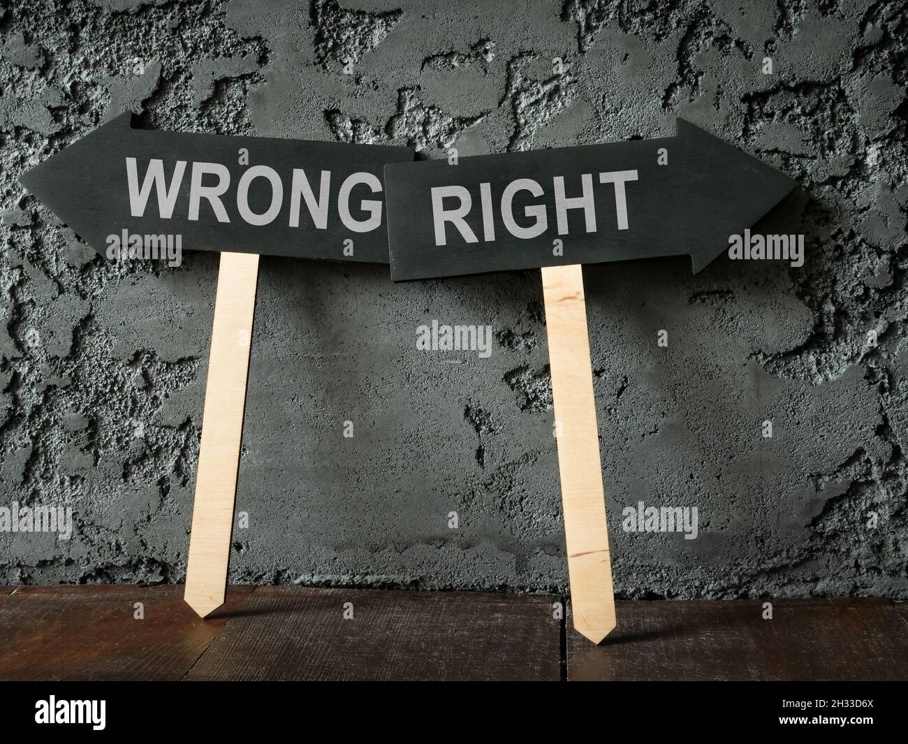 Moral dilemma concept. Dark arrows wrong and right. Stock Photo