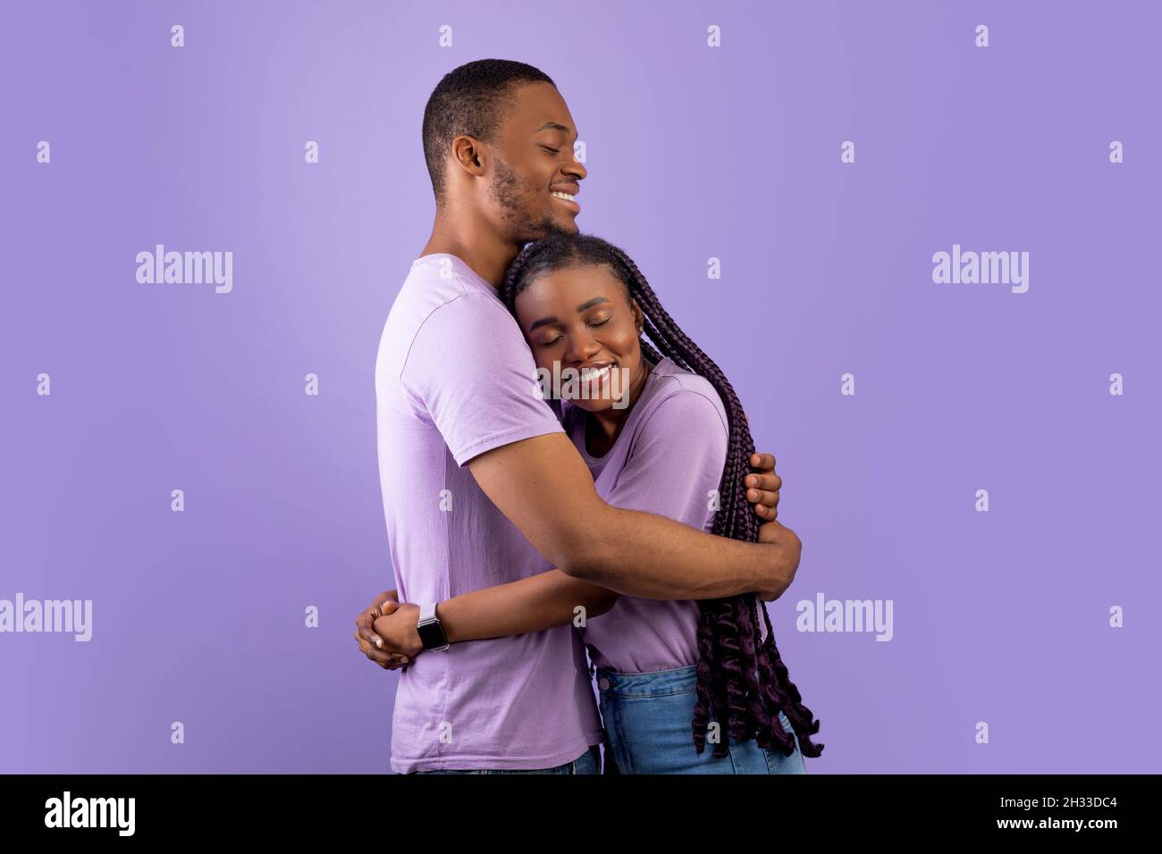 Portrait Of Affectionate Cheerful African American Couple Hugging While ...