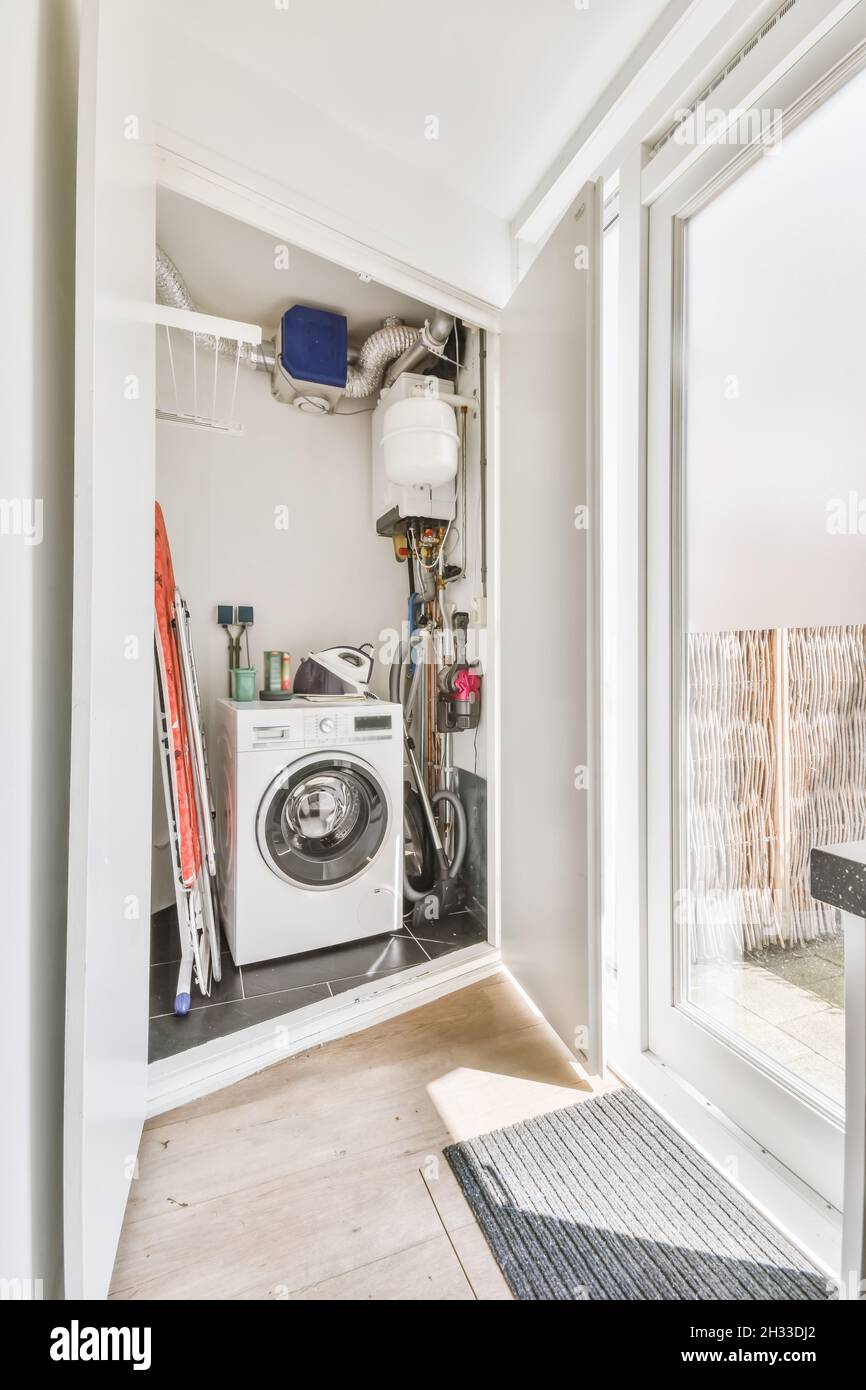Room with washing machine and water pipes Stock Photo Alamy