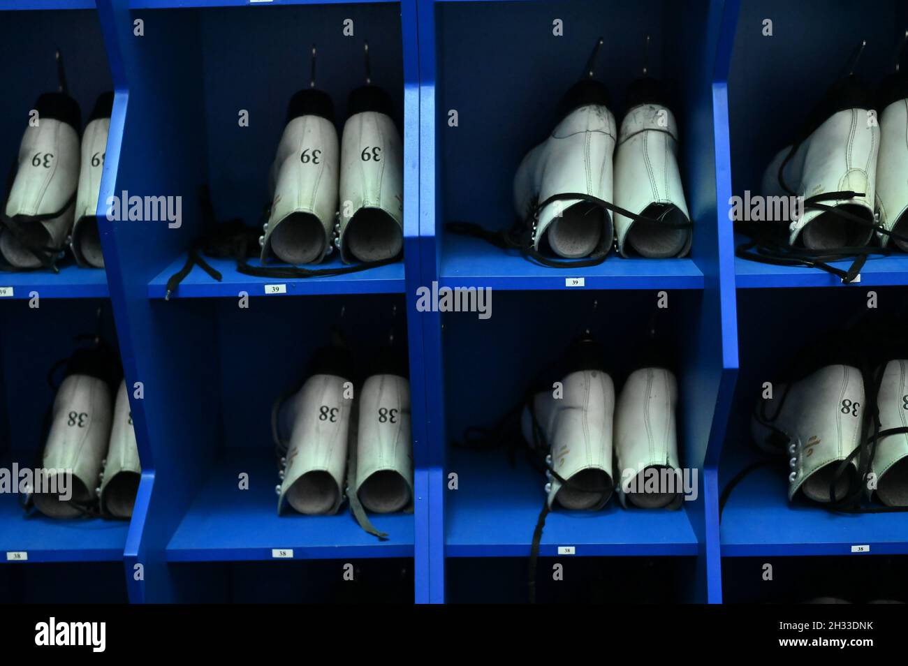 Winter sport. Ice skates for rent are in drying Stock Photo Alamy