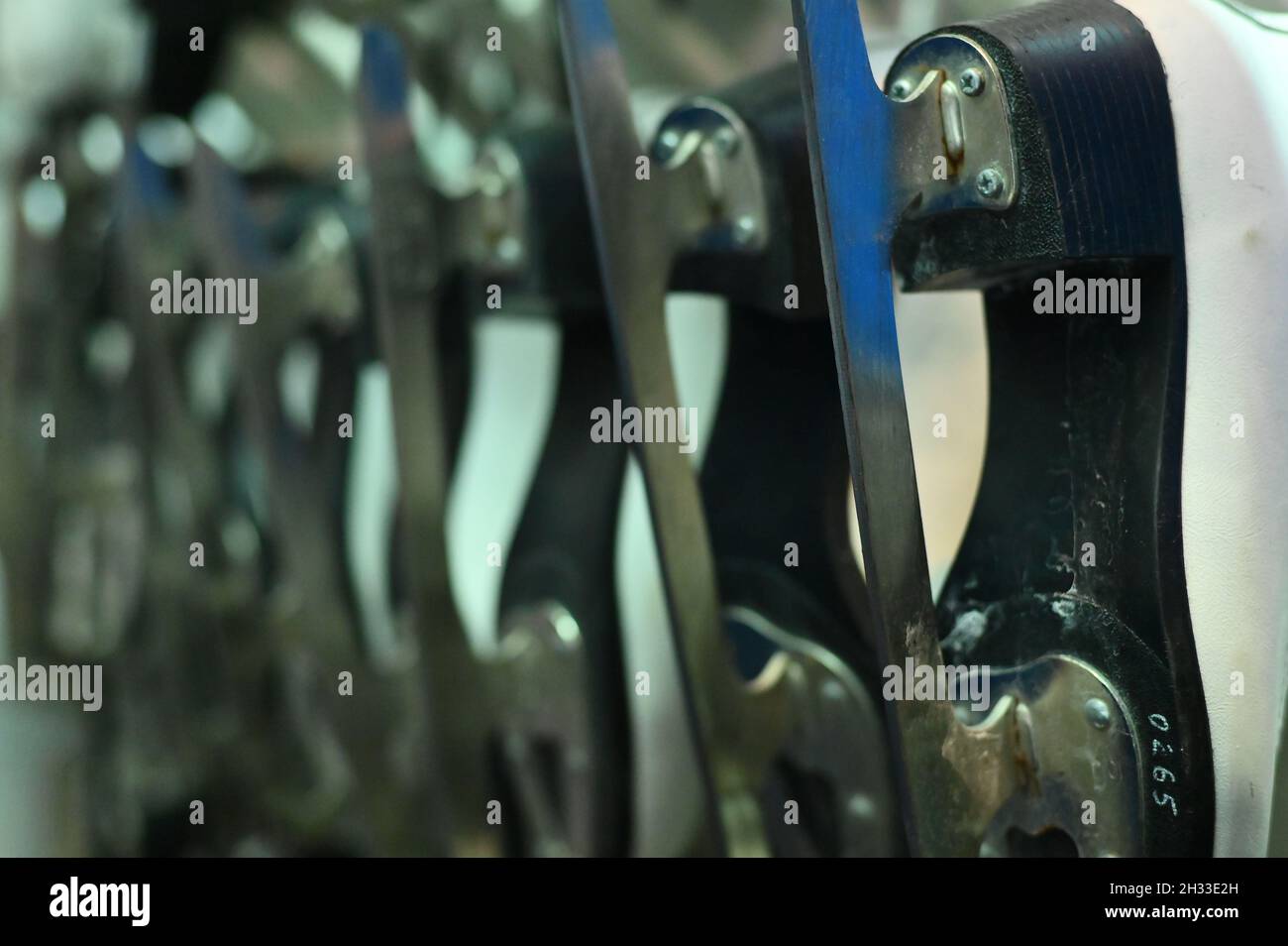 Winter sport. Ice skates for rent are in drying Stock Photo Alamy
