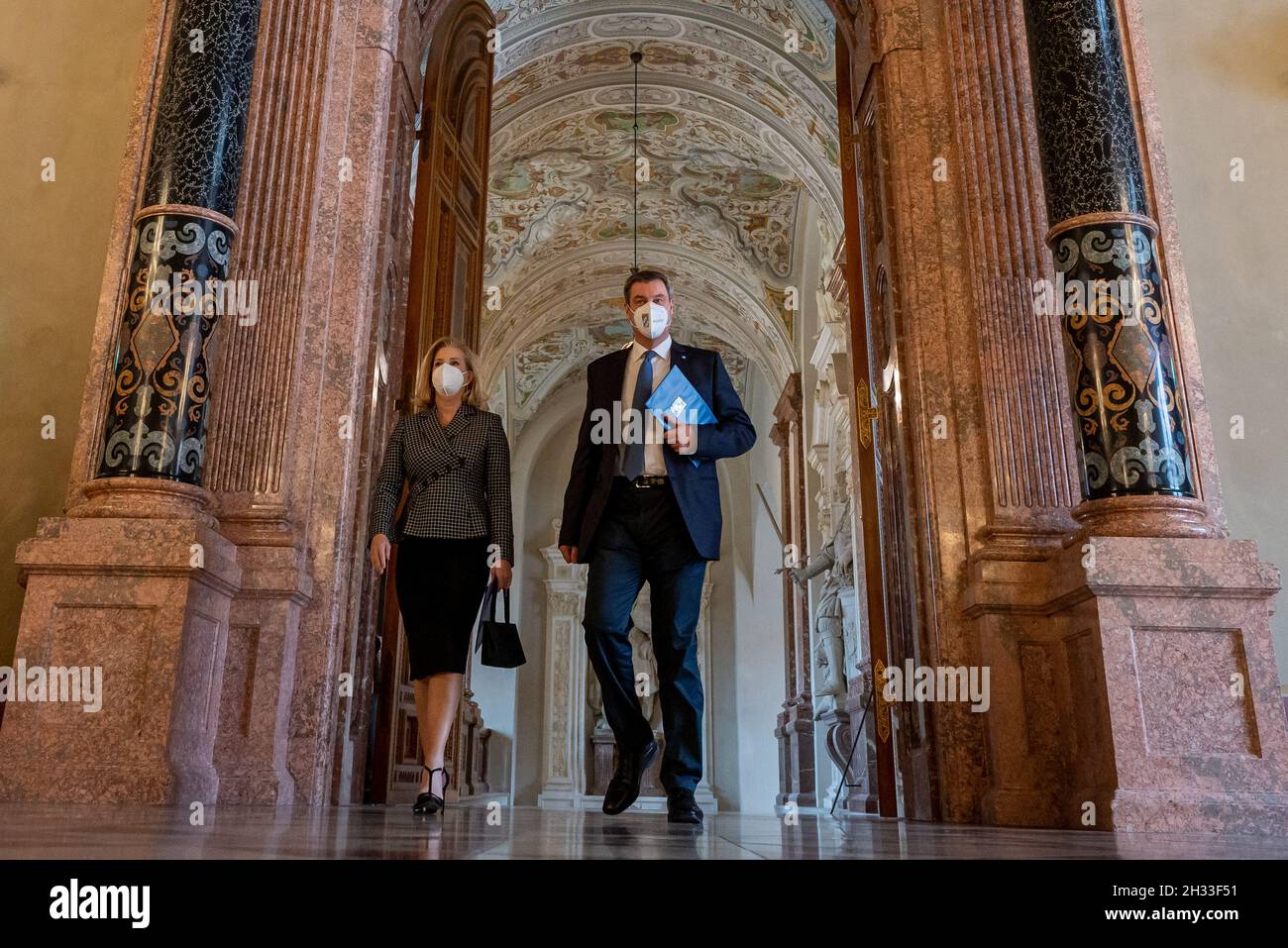 Munich, Germany. 25th Oct, 2021. Christine Wormuth (l), U.S. Secretary of the Army, and Markus Söder (CSU), Minister President of Bavaria, walk through the Residenz into the Kaisersaal before the start of the Bavarian Minister President's flag ribbon ceremony for U.S. Army Europe stationed in Bavaria. The event is being held at the Residenz to commemorate the 75th anniversary of the liberation of the Dachau concentration camp by the US Army's 7th Army. Credit: Peter Kneffel/dpa/Alamy Live News Stock Photo