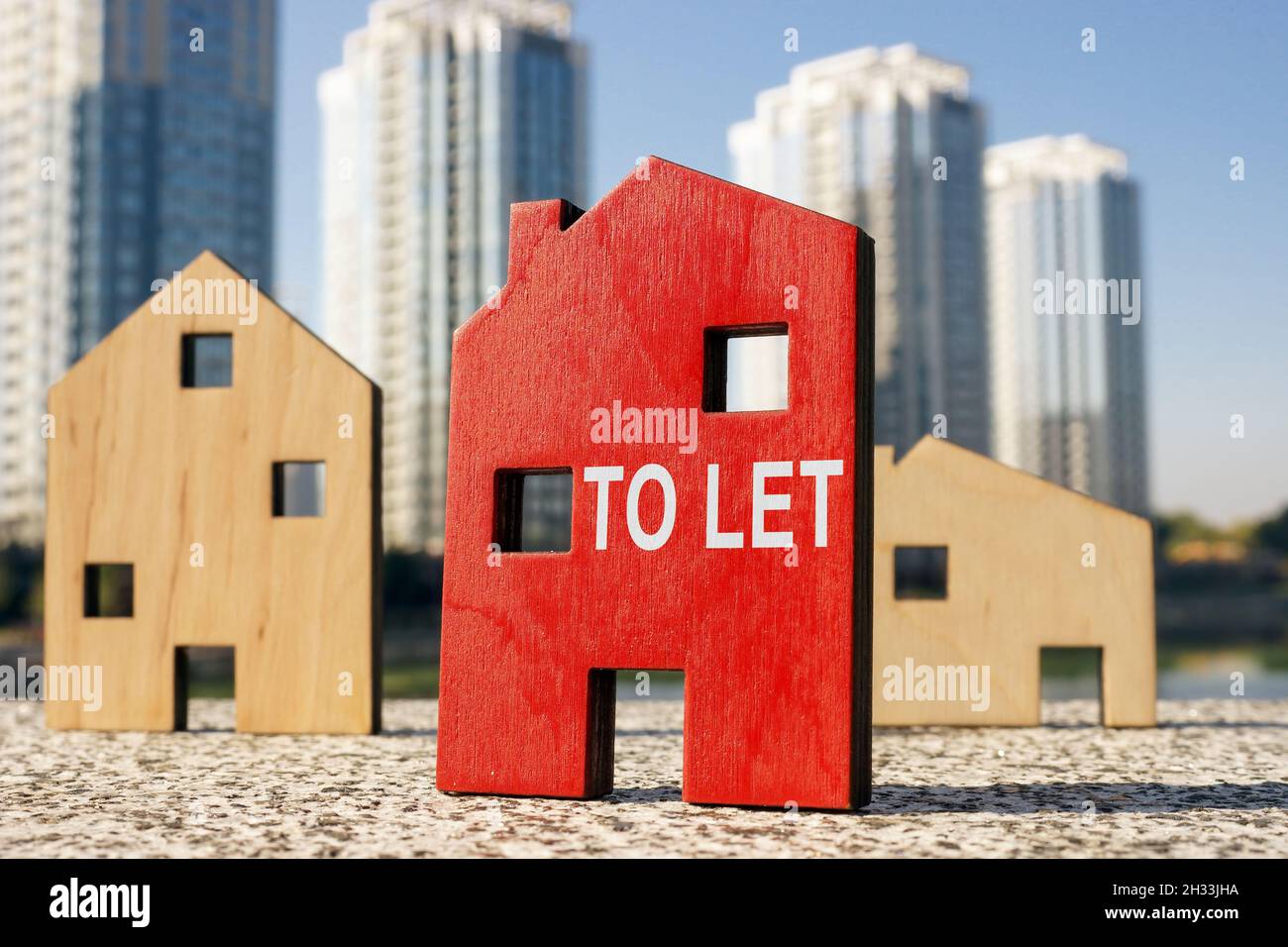 Buy to let concept. Small wooden houses. Stock Photo