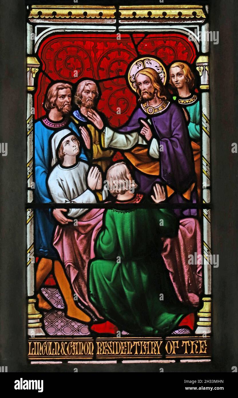 A stained glass window by William Wailes depicting Christ healing the palsied man, All Saints Church, Kings Cliffe, Northamptonshire Stock Photo
