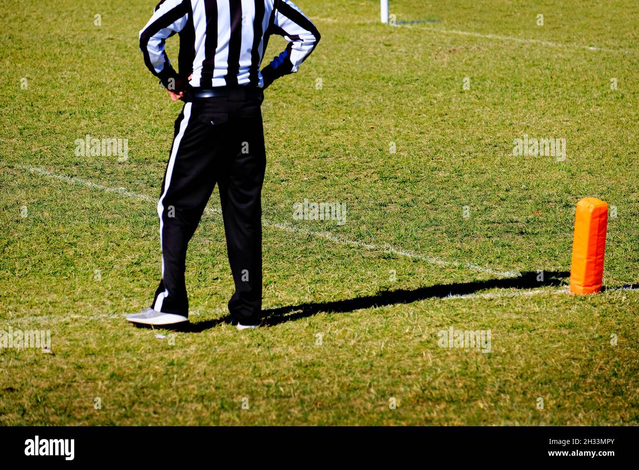 Football referee at the goal line in a game of competition on the field