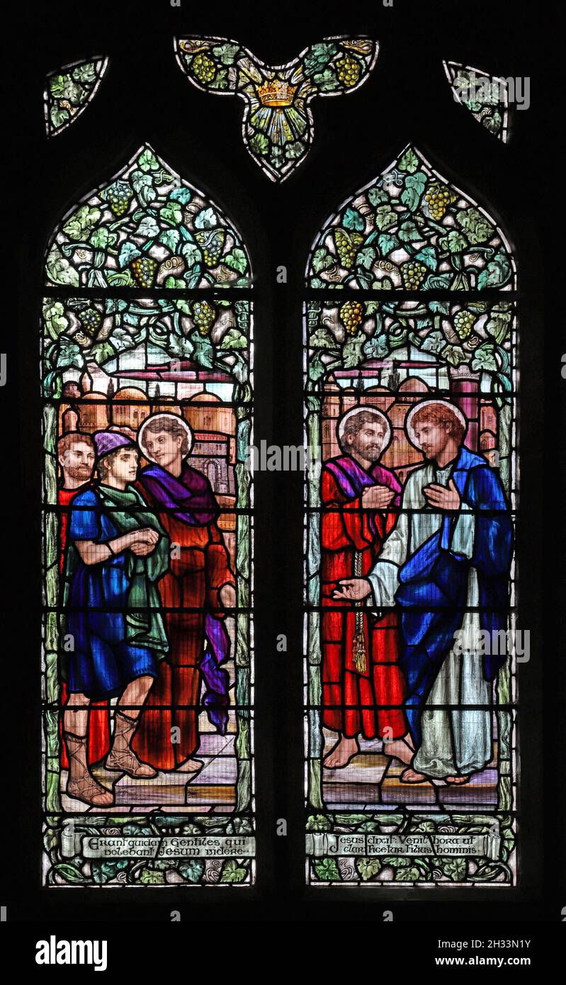 A stained glass window by Mary Lowndes depicting Gentiles truing to reach Jesus with Ss Andrew and Peter, St Andrew's Church, Ufford, Northamptonshire Stock Photo