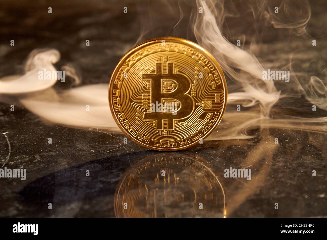 One Golden Ethereum coin one of the Cryptocurrency on hand business woman  with the cryptocurrency graph for trading Stock Photo - Alamy