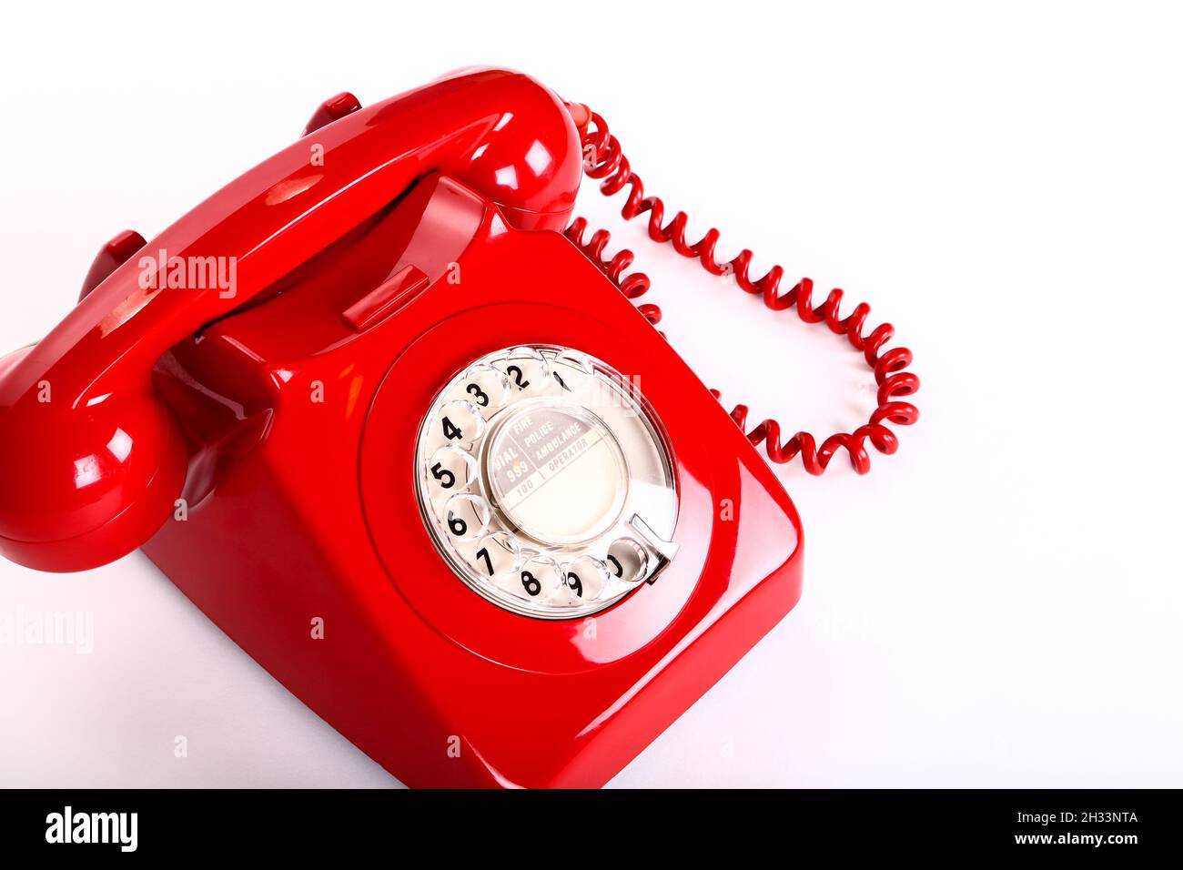 Old vintage GPO red telephone isolated on a white background Stock Photo