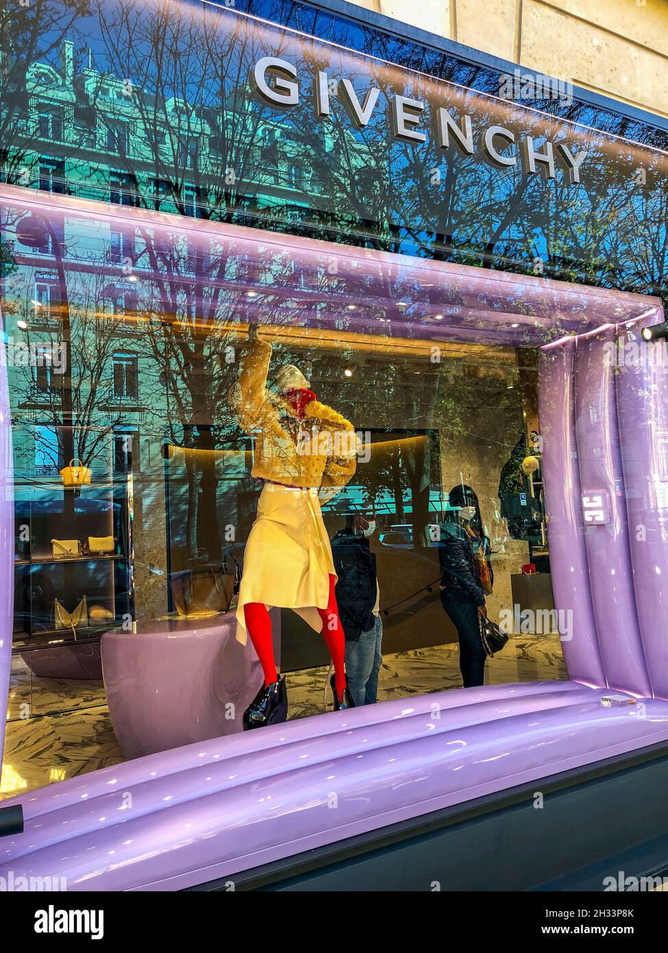 Givenchy Window display, Avenue Montaigne, Paris - people walk in