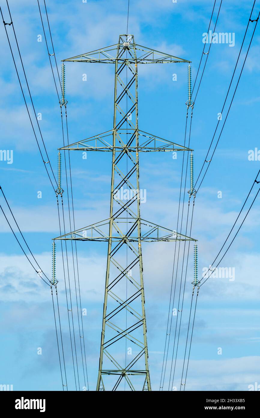 Top part of a pylon of the united Kingdom National Grid with overhead