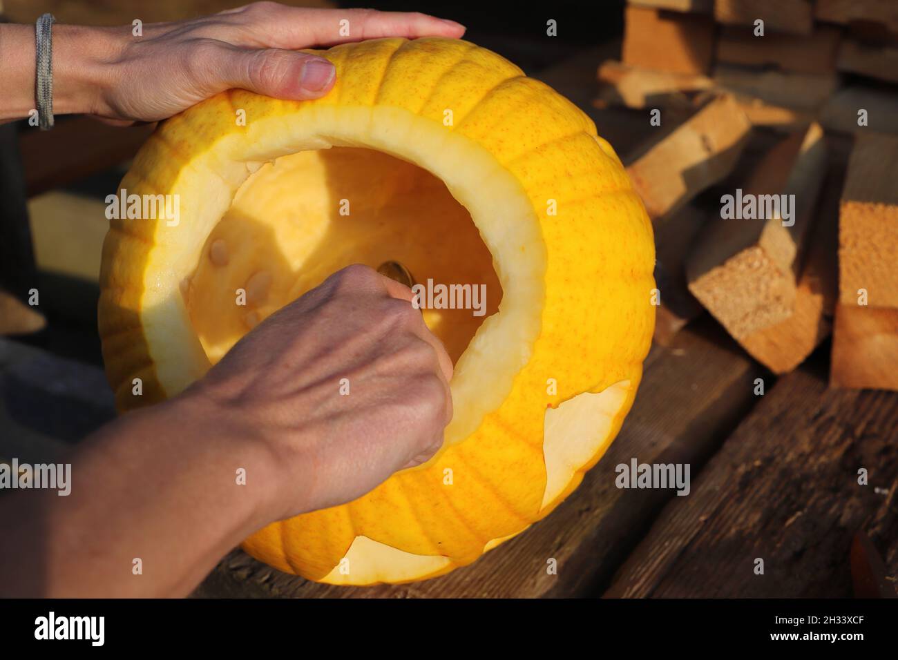 Carve a pumpkin with a knife for Halloween Stock Photo Alamy