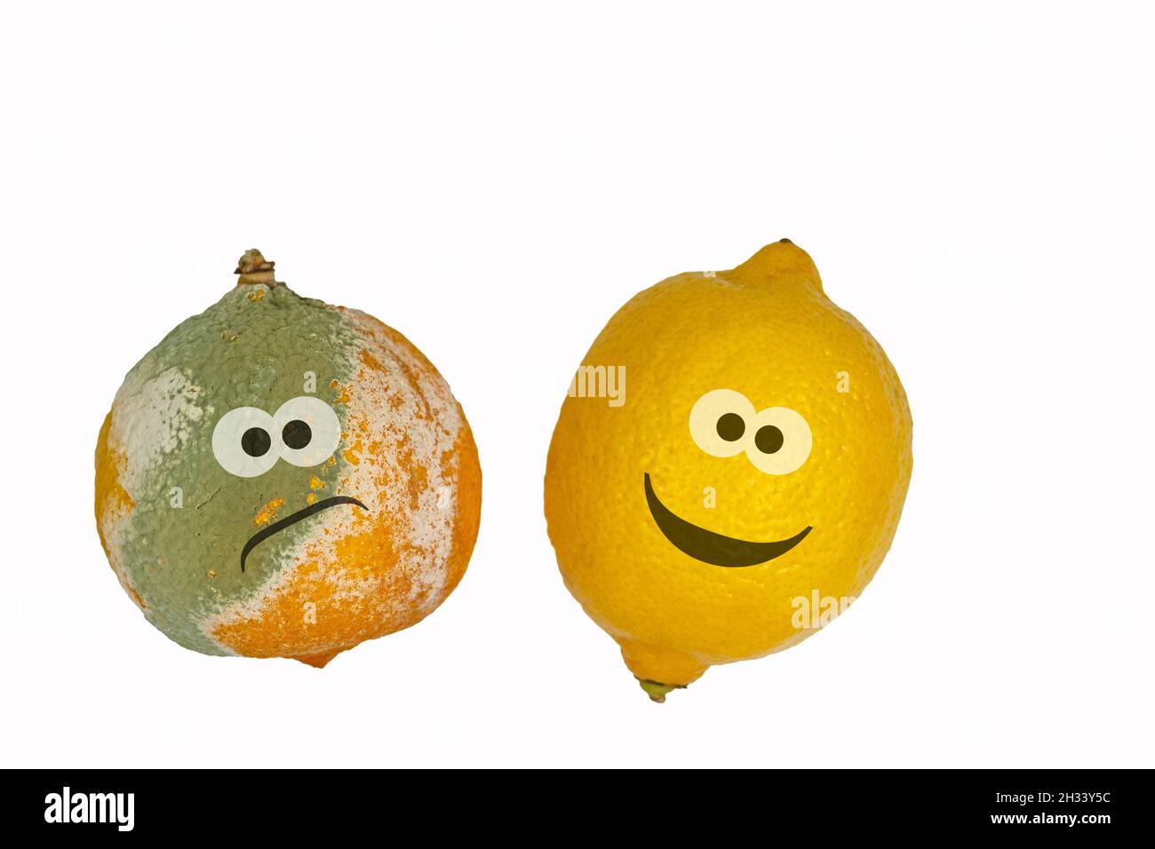 Lemons with face against white background Stock Photo