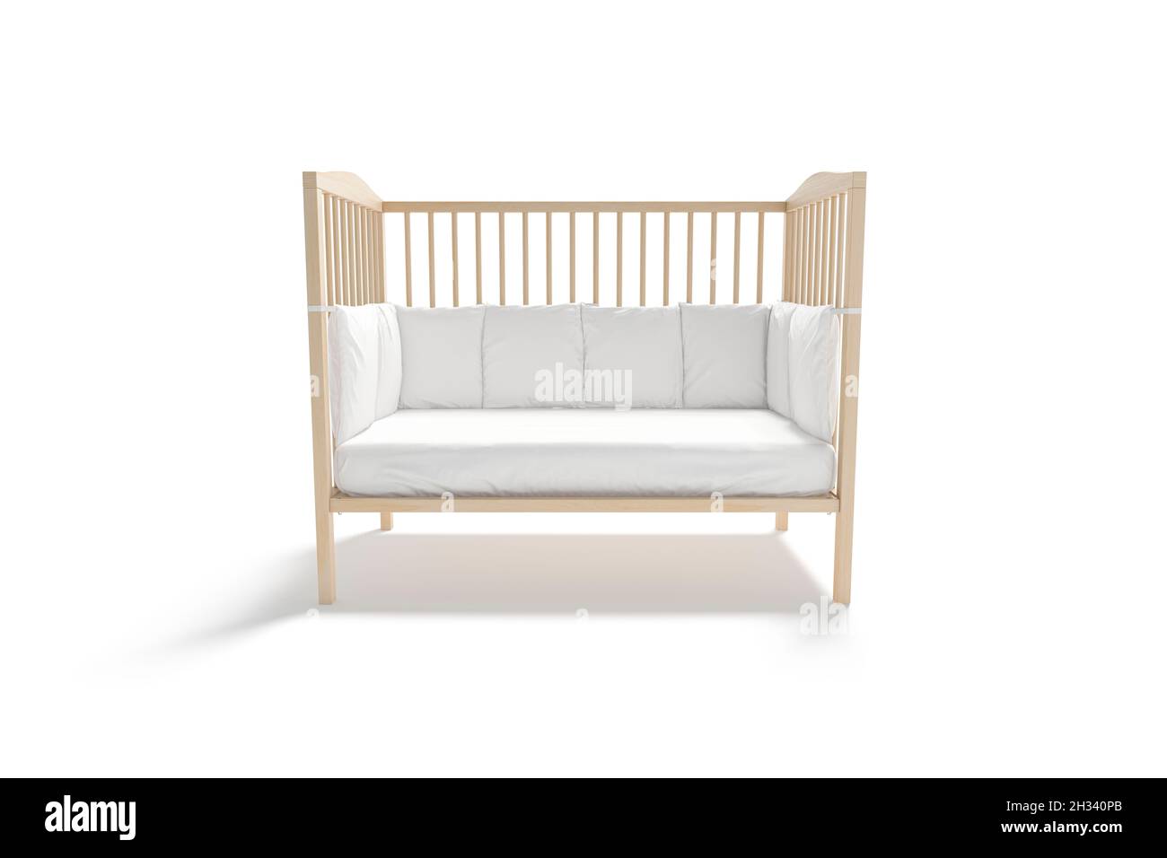 Blank wood cot with white crib sheet, protective bumpers mockup Stock Photo