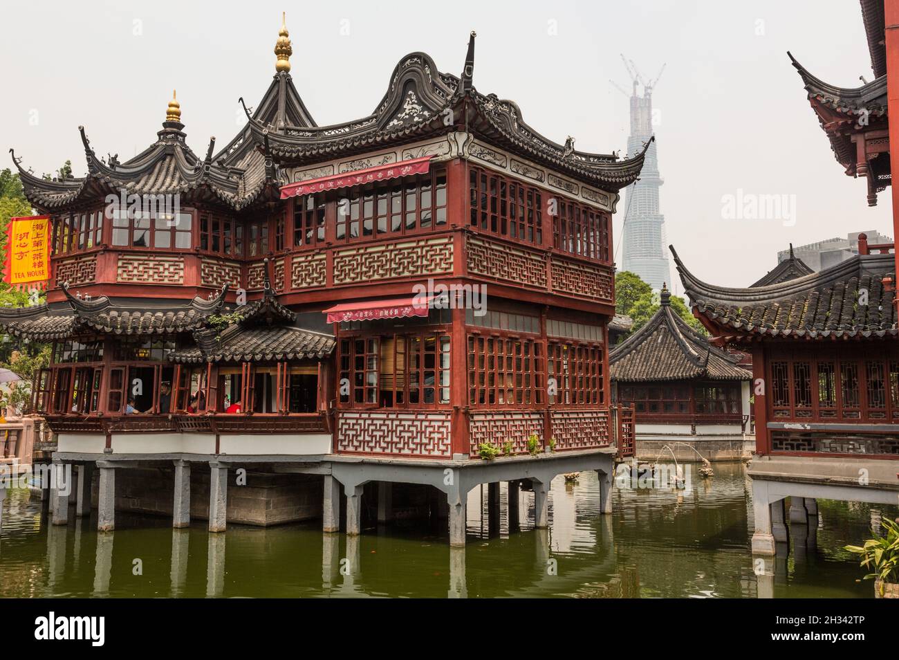The historic Huxinting Teahouse with the Shanghai Tower