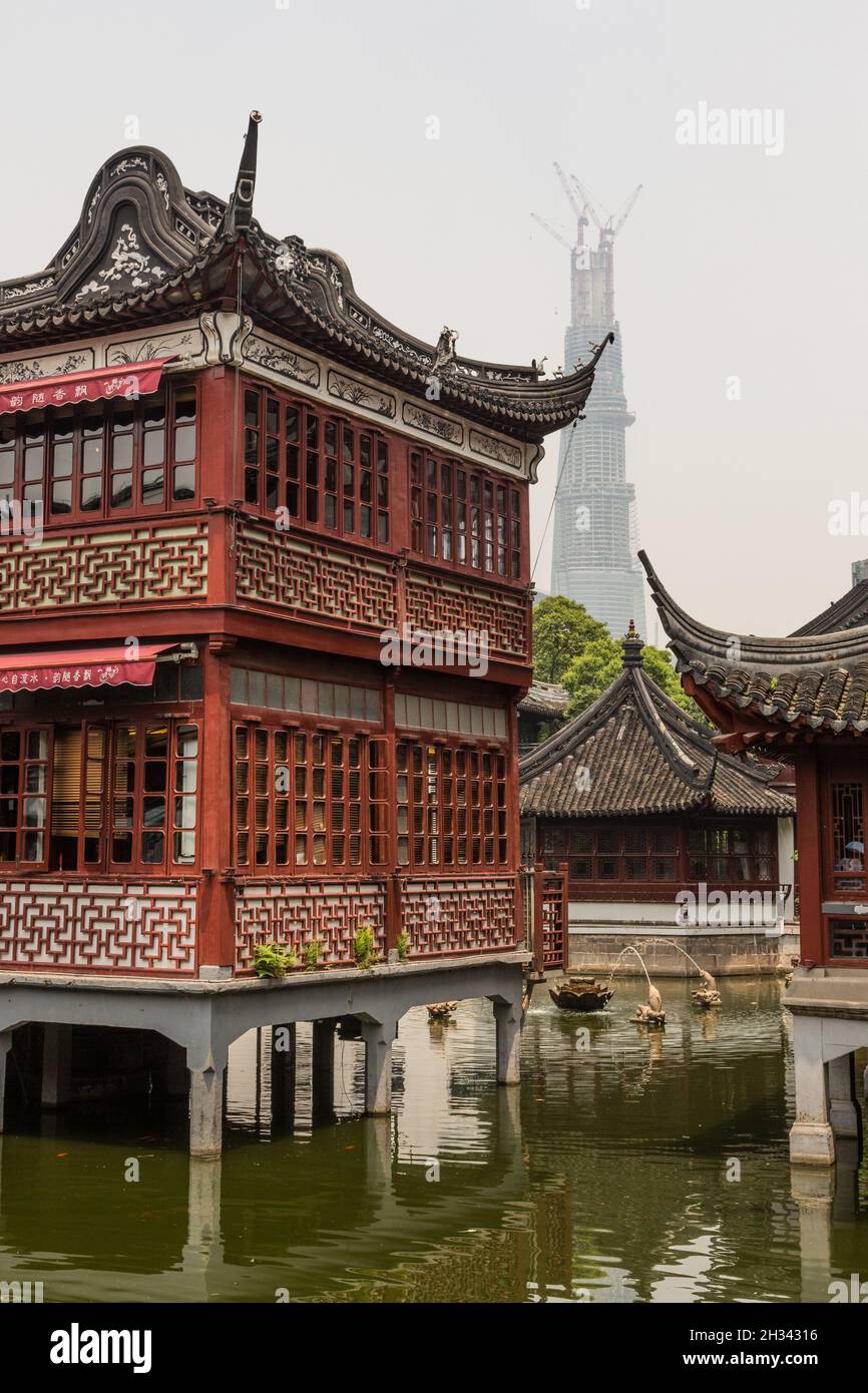 The historic Huxinting Teahouse  with the Shanghai Tower under construction ibhind.  Shanghai, China. Stock Photo