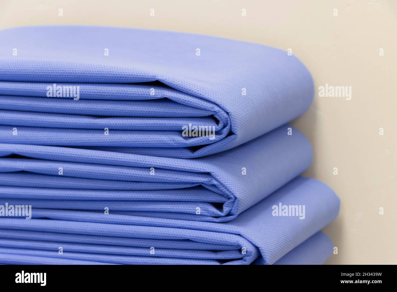 Closeup Image Of Folded Blue Drape Sheet Selective Focus Stock Photo