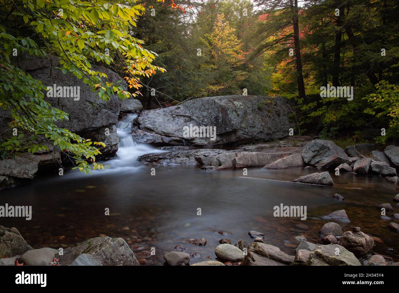 Beautiful view of a river flowing over the rocks Stock Photo - Alamy