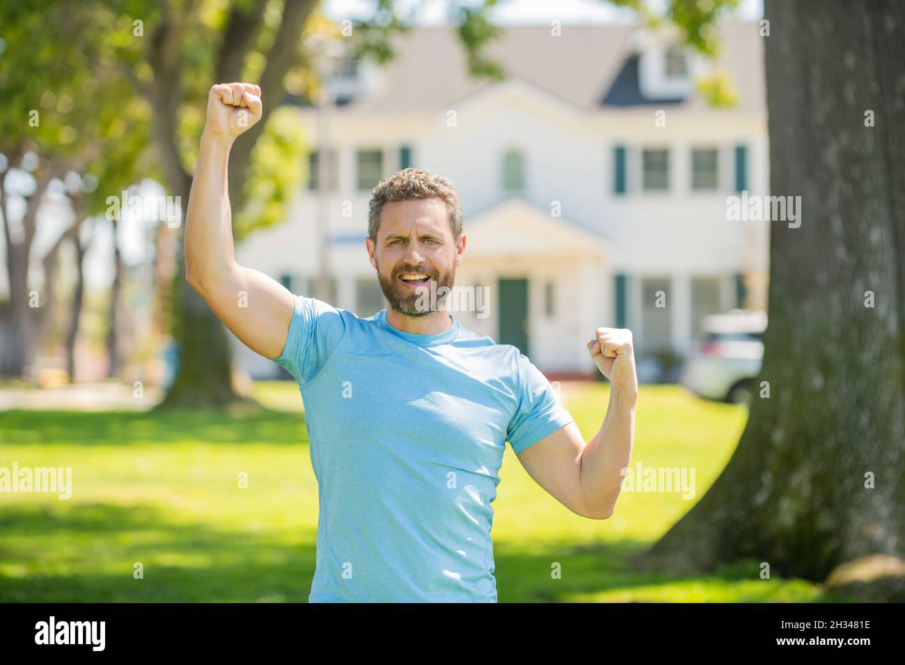 concept of success. real estate agent at house for sale. realtor welcoming visitors. Stock Photo