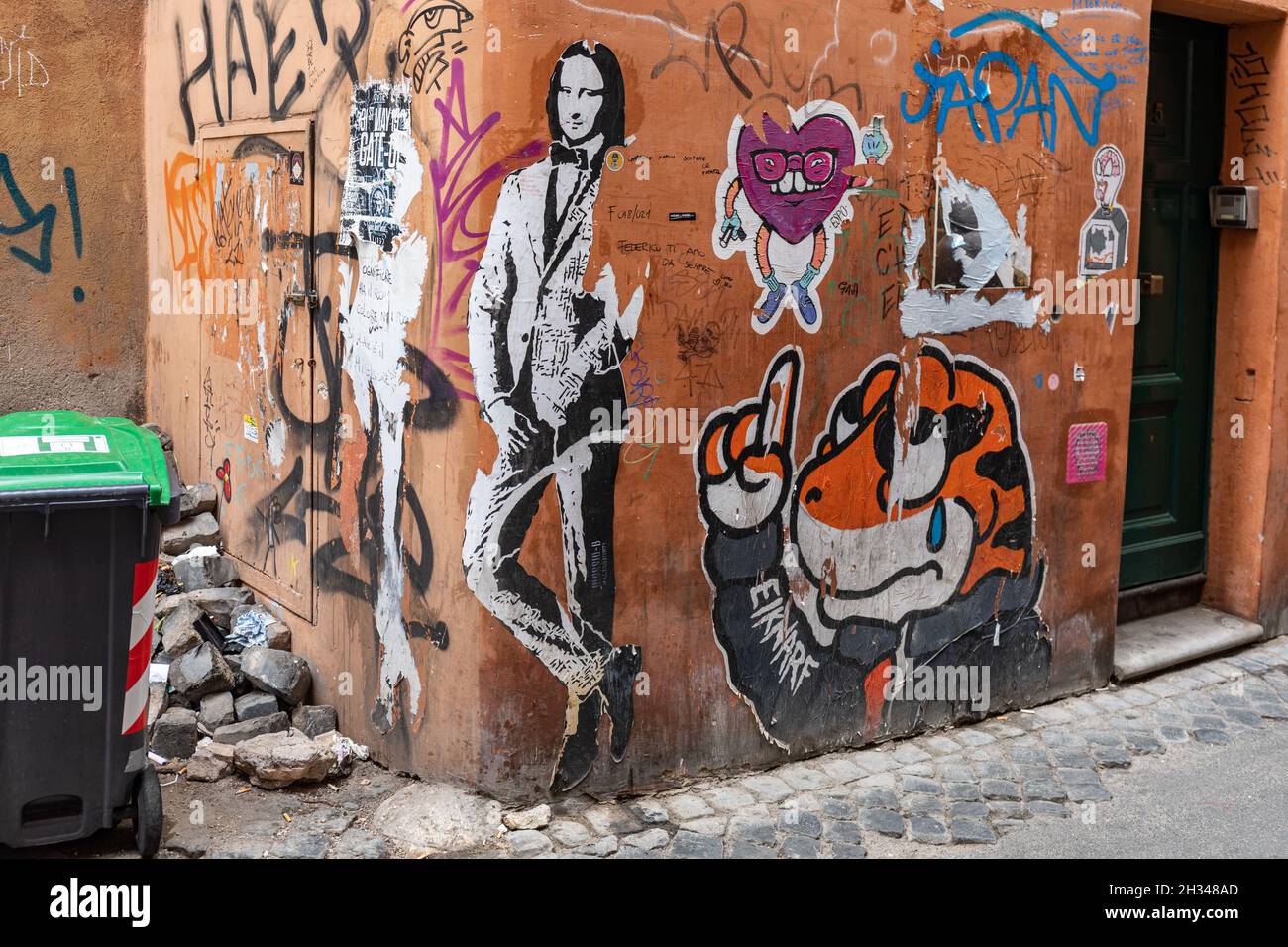Cuttoshape pasteup posters on a street corner in Trastevere district