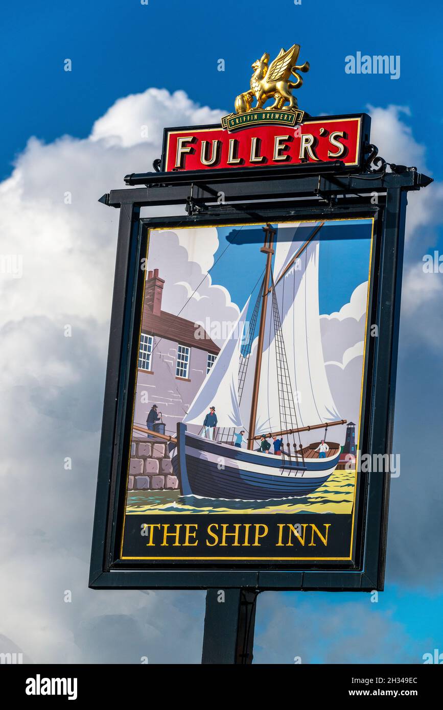 Sign outside The Ship Inn a Fullers public house on the quay overlooking the sea at Langstone, Emsworth Harbour, Havant, Hampshire, England, UK Stock Photo