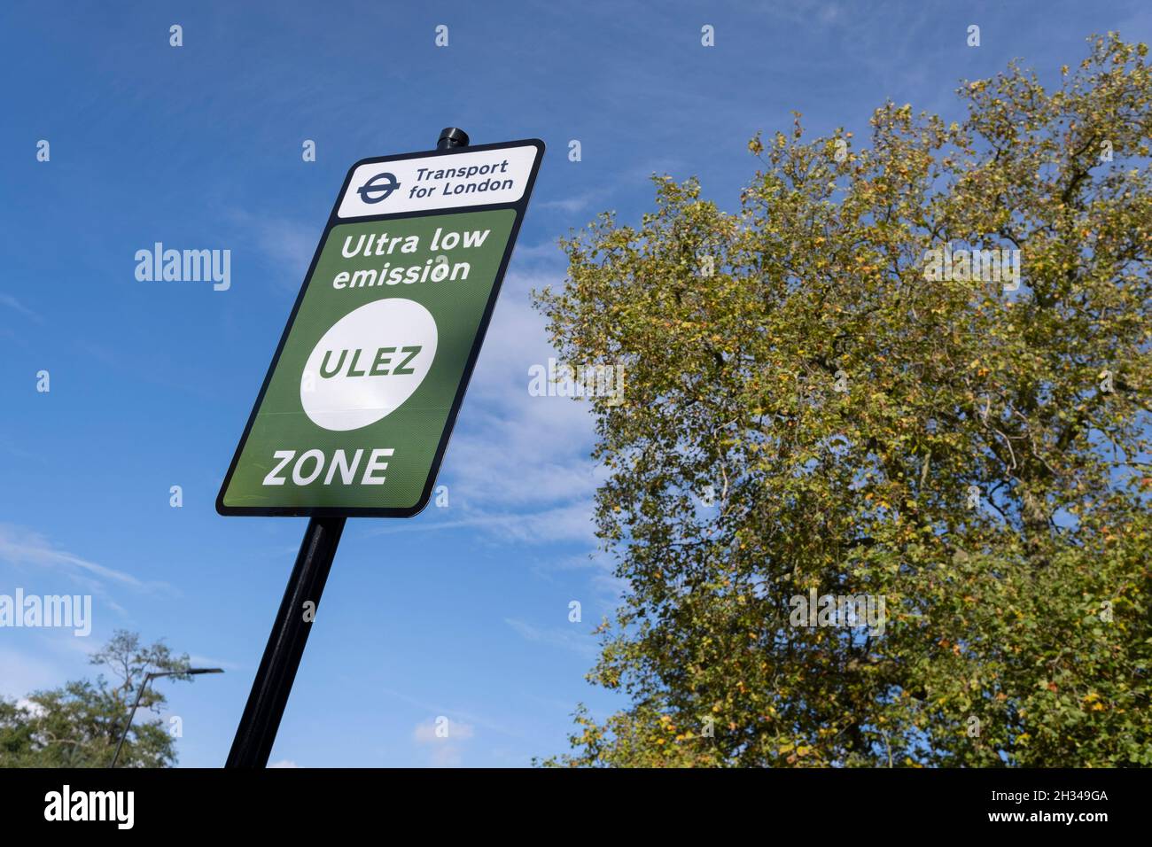 Transport for London's (TFL) new signposts for the new Ultra Low Emissions Zone (ULEZ) have been erected around the inner orbital road perimeter around the capital, and seen on the South Circular in Dulwich on the day that the new area becomes effective for newer vehicles, on 25th October 2021, in London, England. Now 18 times larger, the new ULEZ area bans older vehicles such as polluting diesels and petrol cars older than 2006, an attempt to lower poisonous emissions that further harm the health of 1 in 10 children who have asthma. Drivers of non-exempt vehicles may enter the ULEZ after payi Stock Photo
