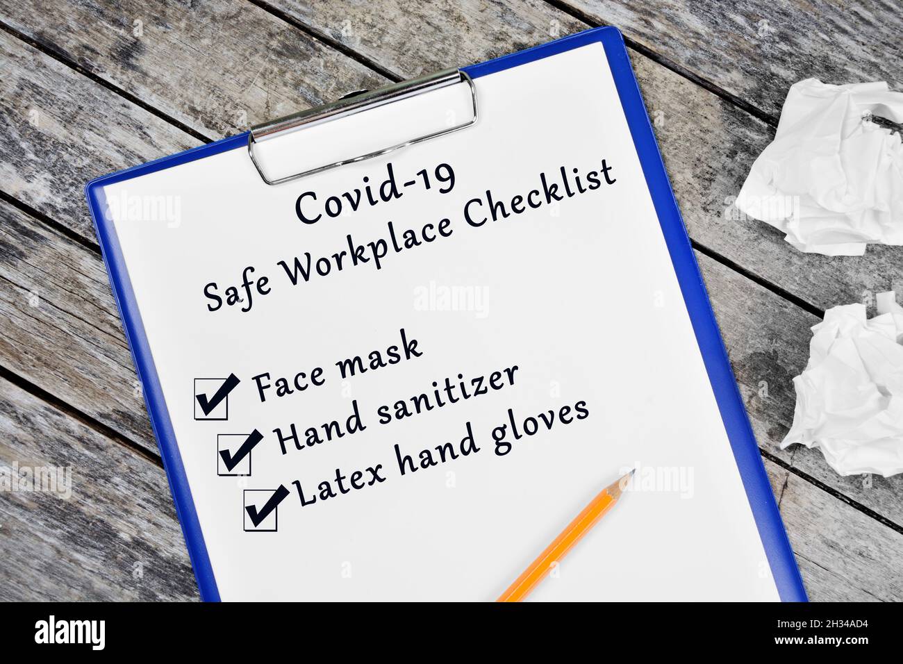 Covid 19 Safe workplace written on paper Stock Photo