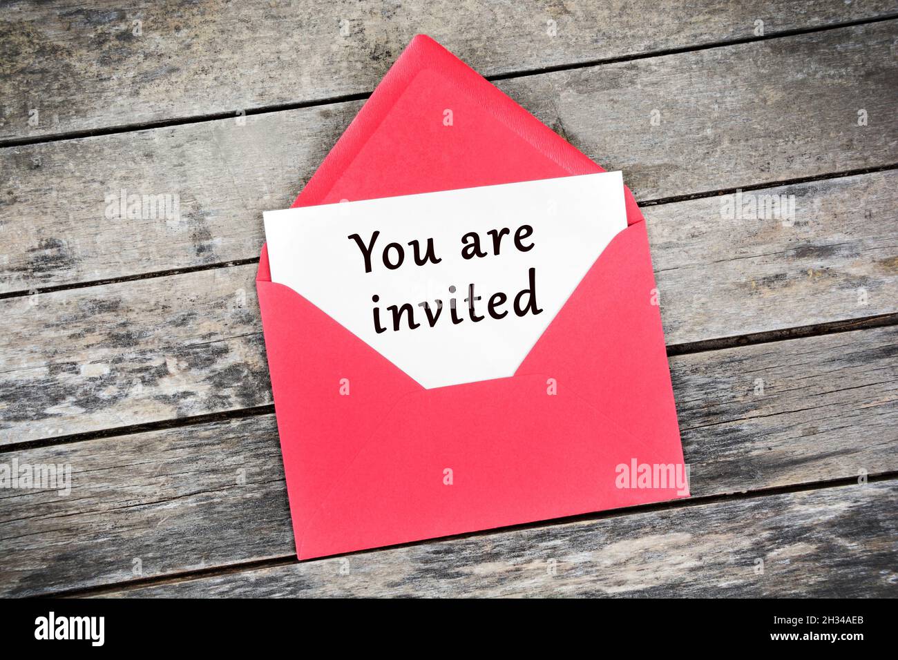You are invited text on white paper. Top view Stock Photo