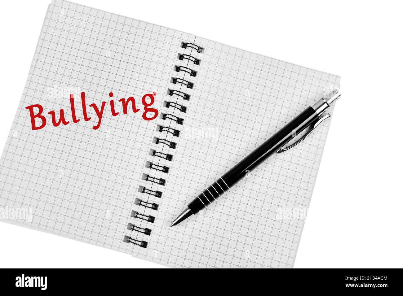 Bullying word on notebook page close-up Stock Photo