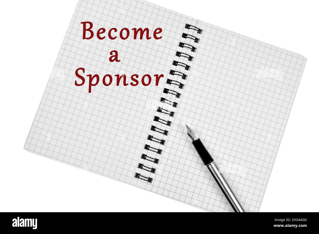 Become a sponsor words on notebook page close up Stock Photo
