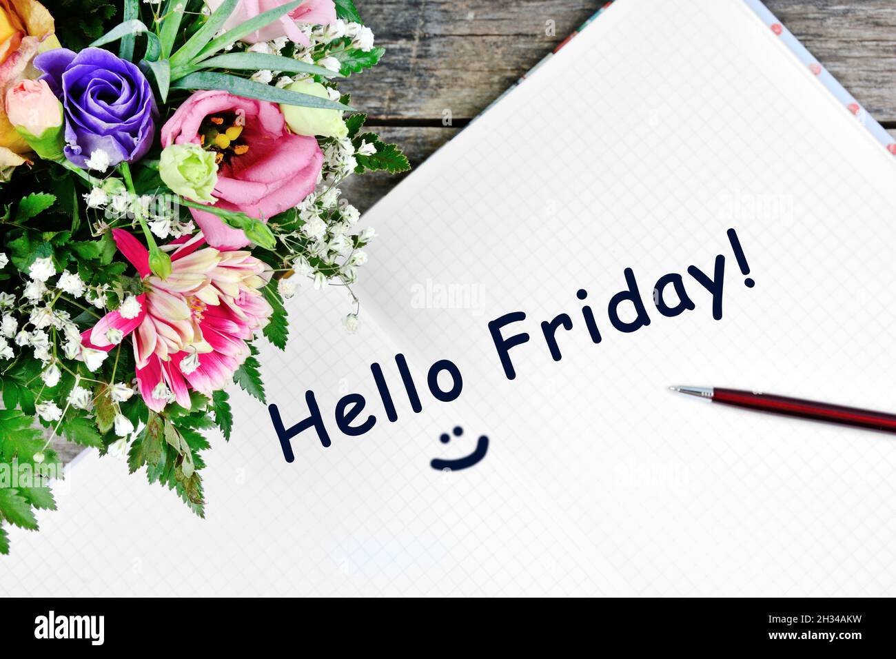 Hello friday words on notebook page. Top view Stock Photo