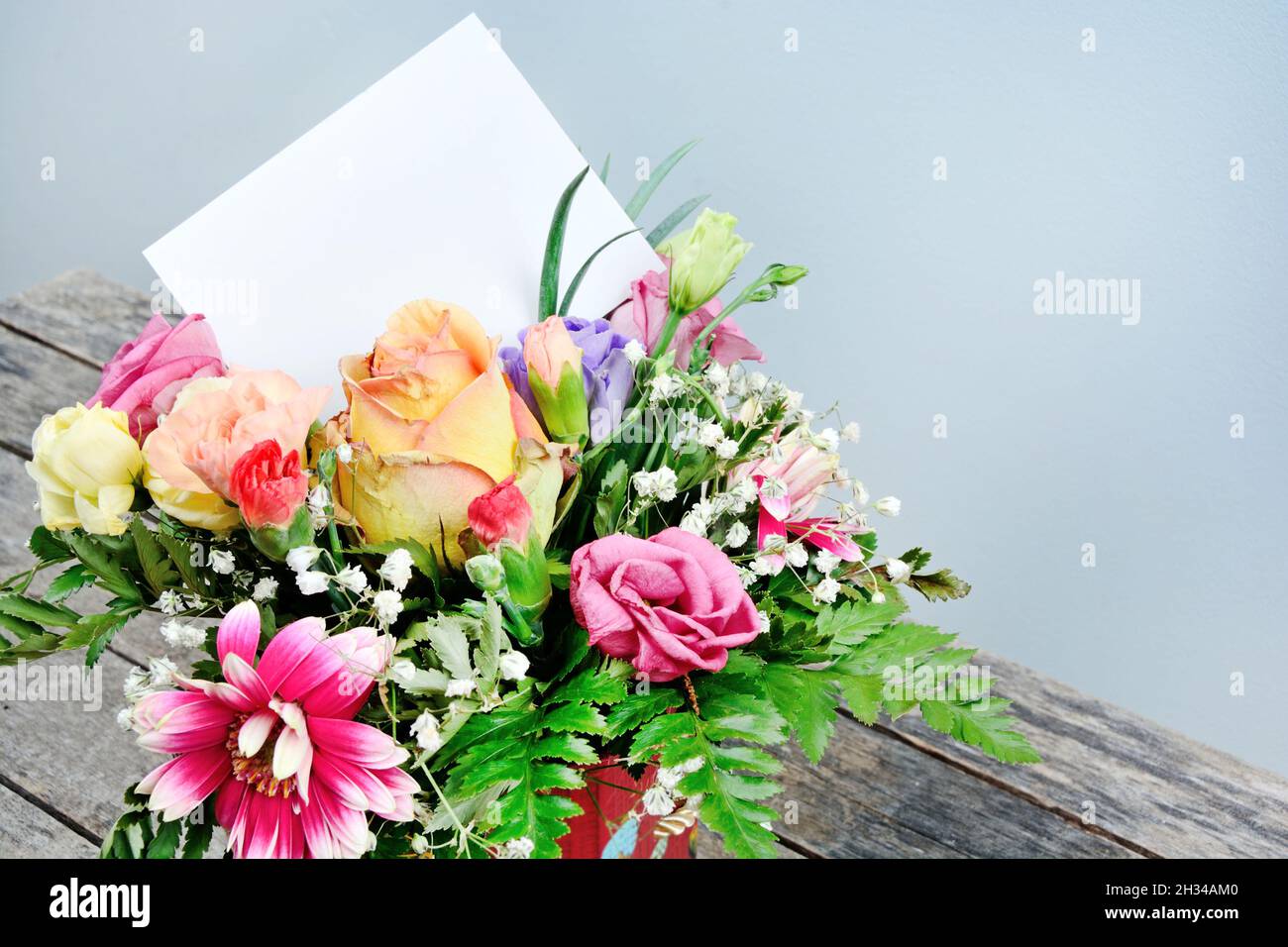 Empty paper on a flower bouquet. Close up Stock Photo