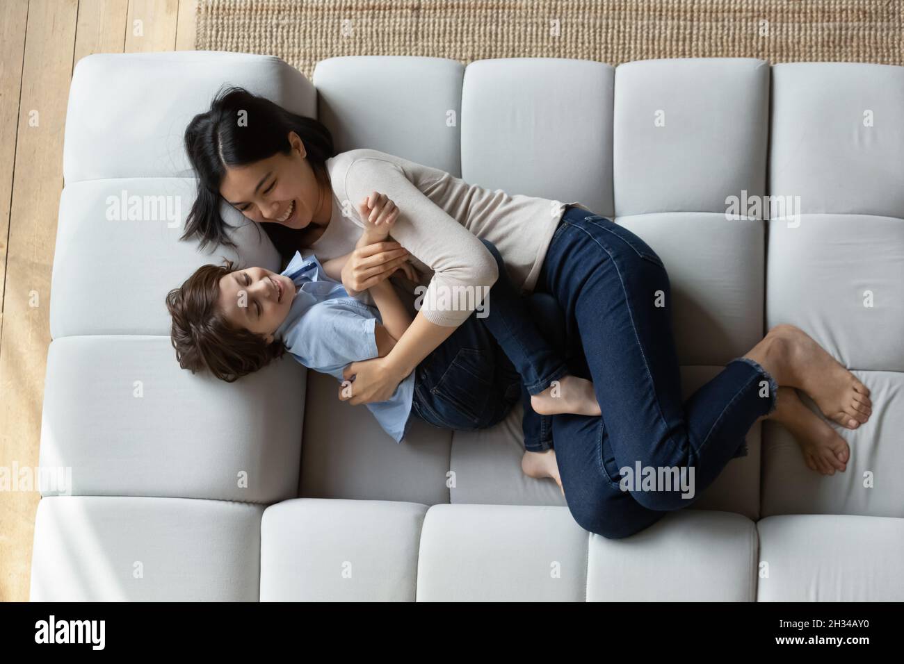 Mother cuddling young son hires stock photography and images Alamy