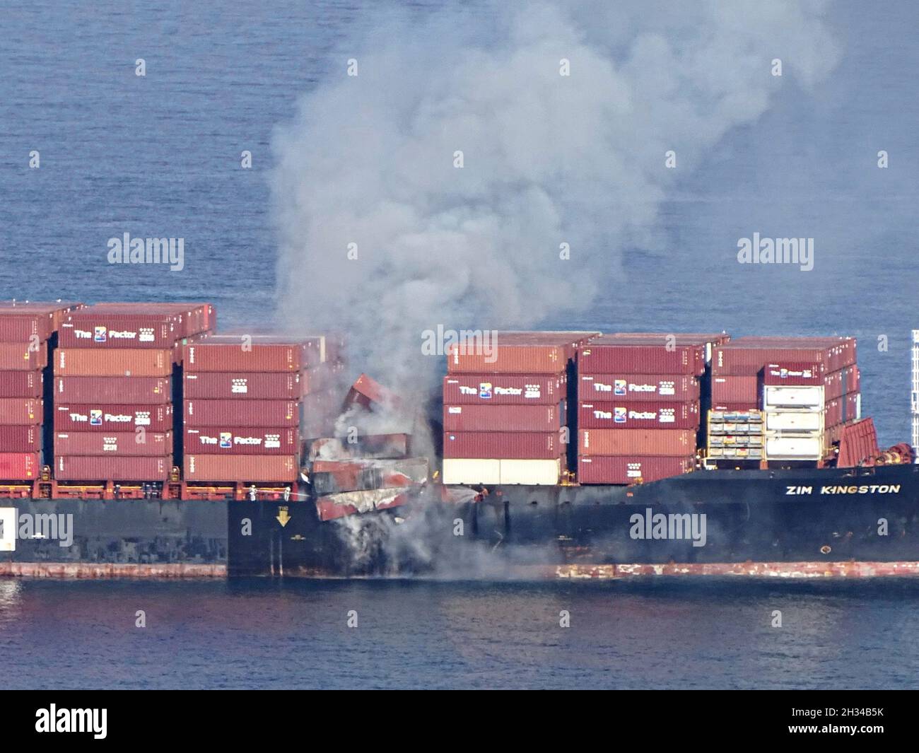Victoria, Canada. 23rd Oct, 2021. The commercial cargo ship MV ZIM Kingston, burns after losing 40 shipping containers during transit in the Strait of Juan de Fuca October 23, 2021 near Victoria, British Columbia, Canada. The shipping containers were carrying potassium amylxanthate which ignited. Credit: PO3 Diolanda Caballero/U.S. Coast Guard/Alamy Live News Stock Photo